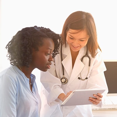 HCP explaining health needs with patient